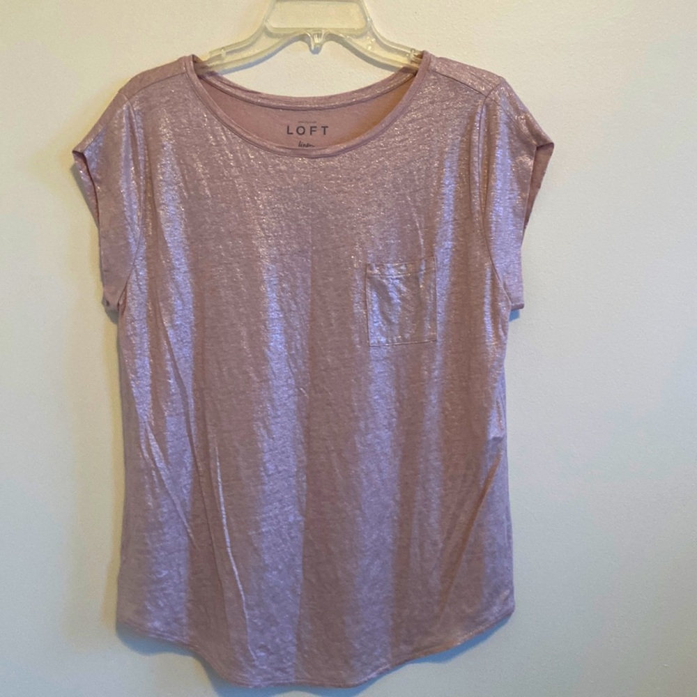 Shimmery champagne colored one pocket tee.
